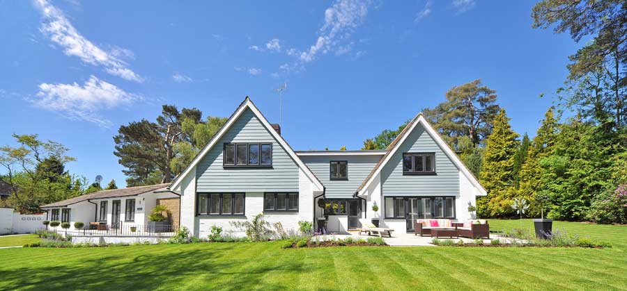 An exterior image of a lovely home with very nice landscaping